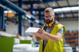 Warehouse working checking OSHA compliance
