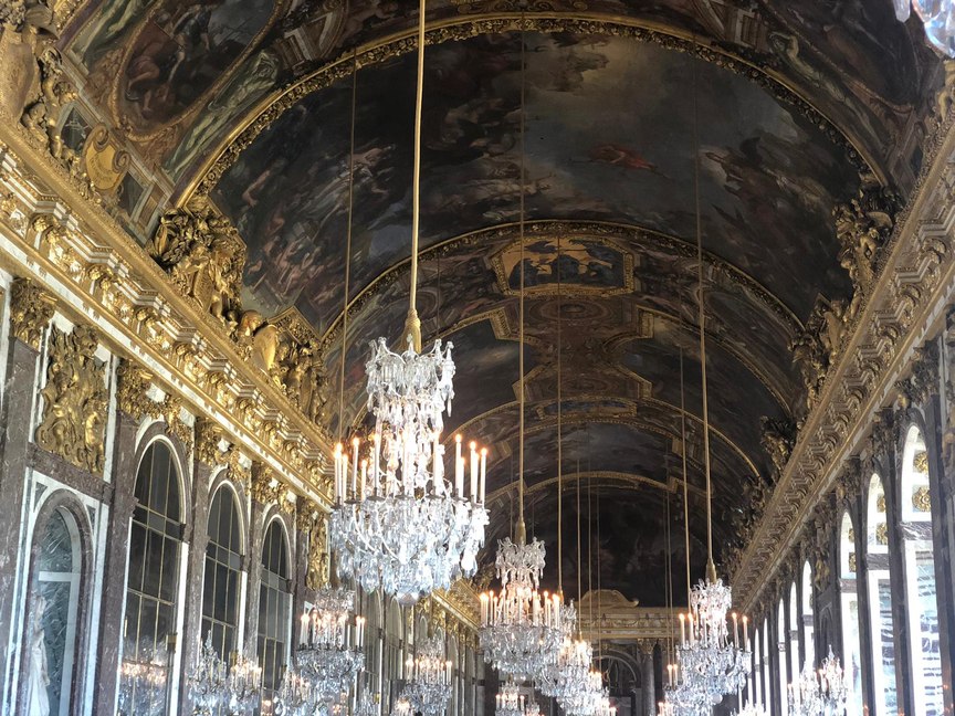 Gilded hall lined with crystal chandeliers