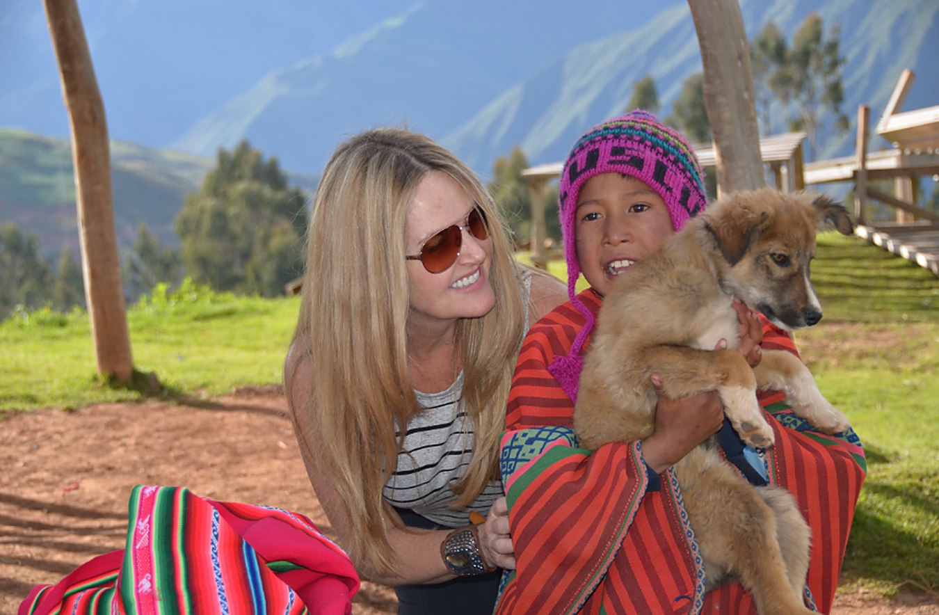 Cheree on the road with a child and a dog