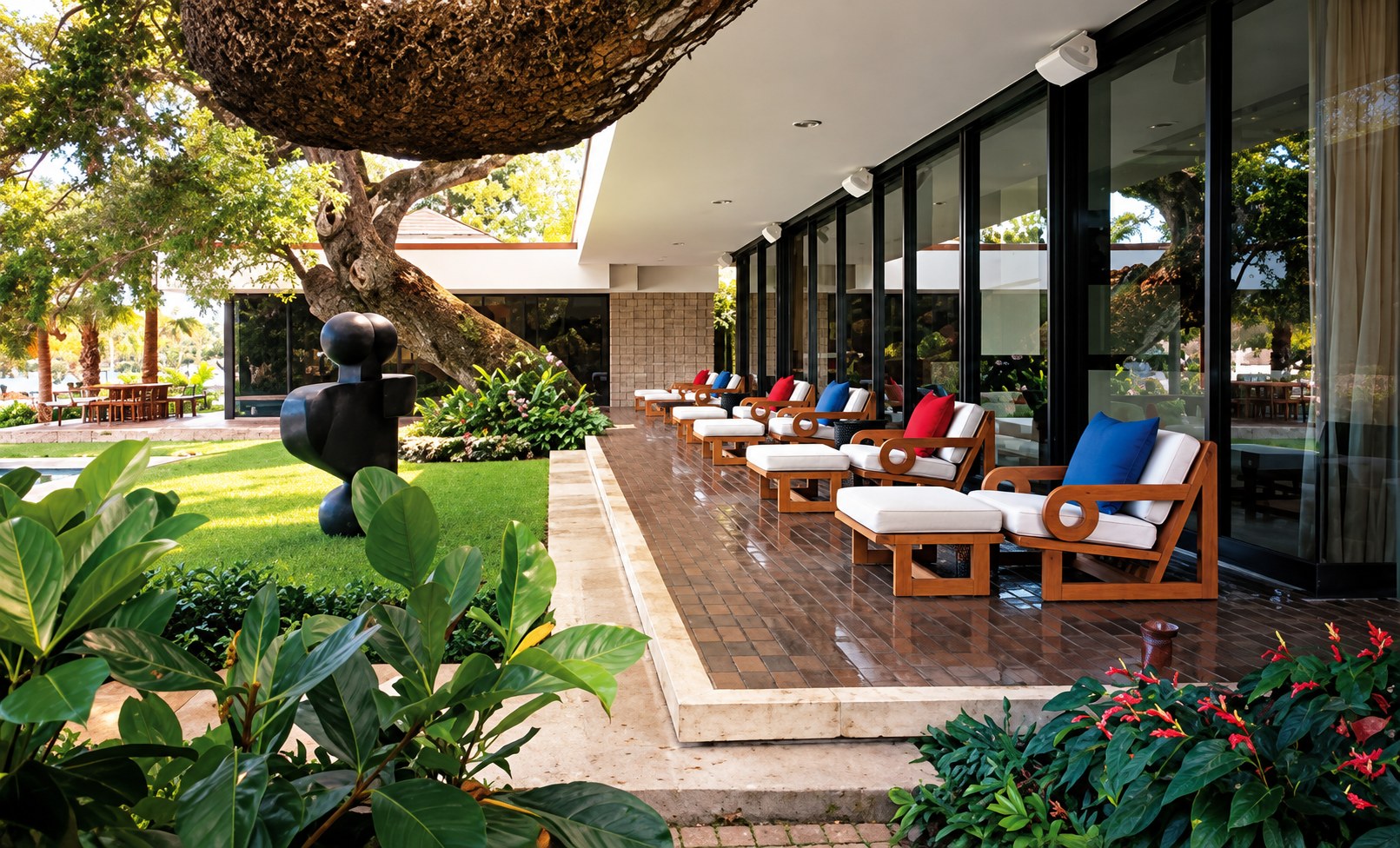 Long covered lanai lined with teak loungers