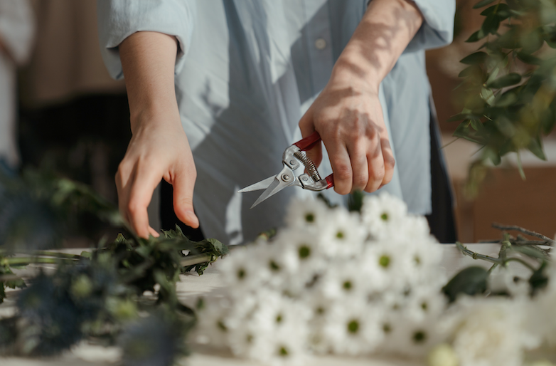 Fresh flower arrangement being cared for to last longer