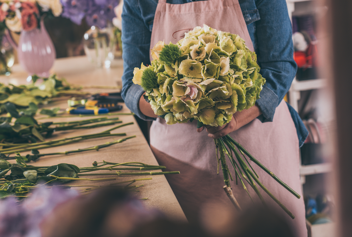 Florist at work on an arrangement in New York City