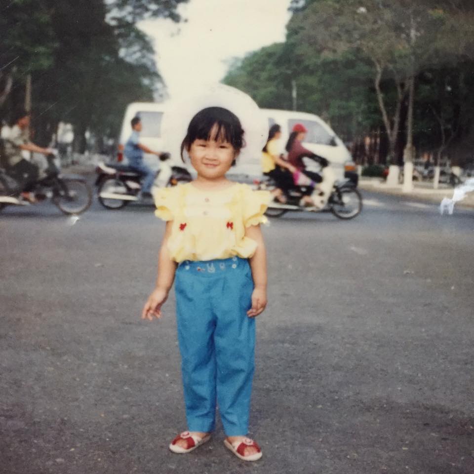 Baby photo in yellow shirt and blue pants