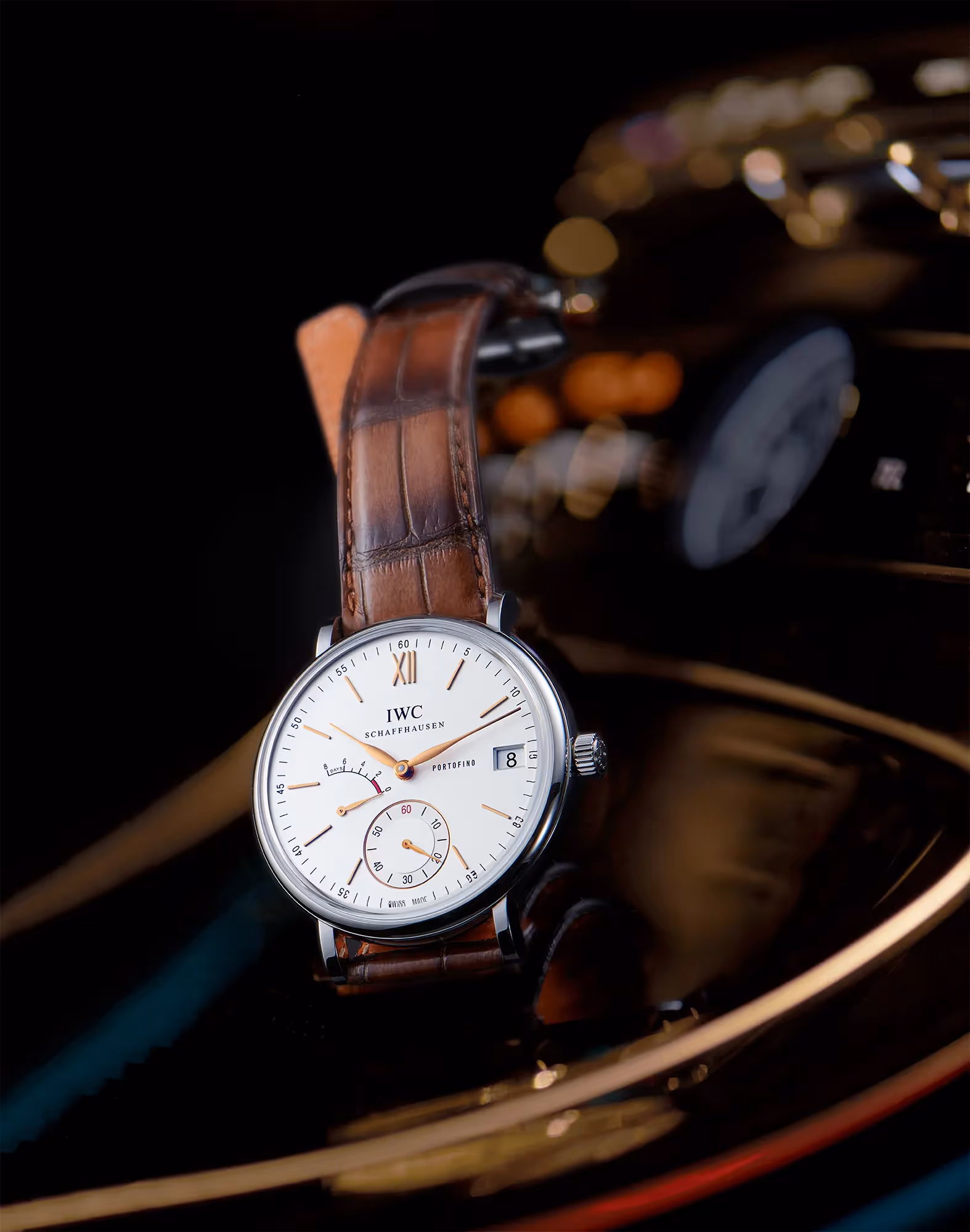 photo still life de la montre portofino de la marque iwc prise à l'intérieur d'une mercedes