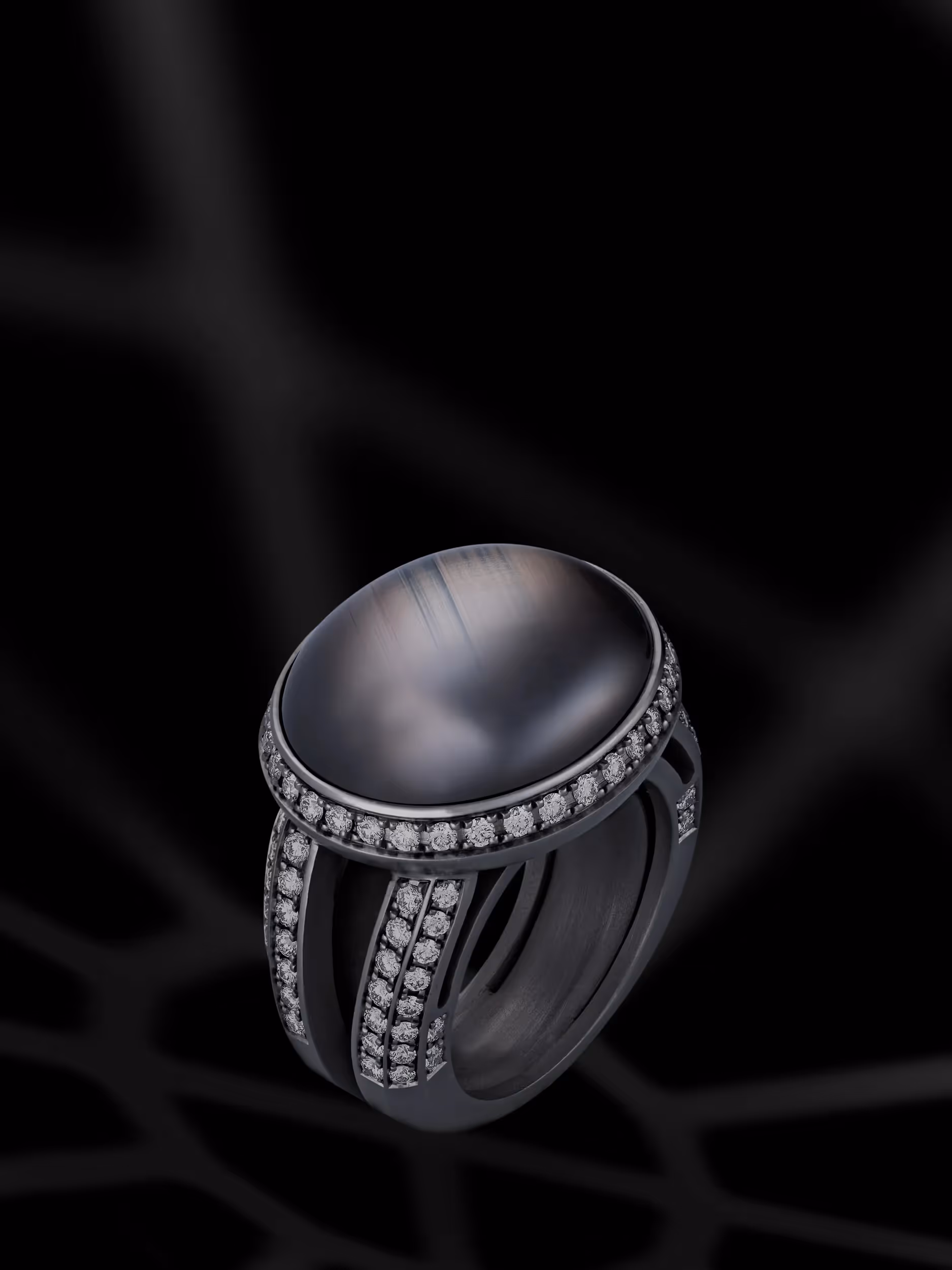 photographie de bijoux, une bague or noirci avec un saphir etoil