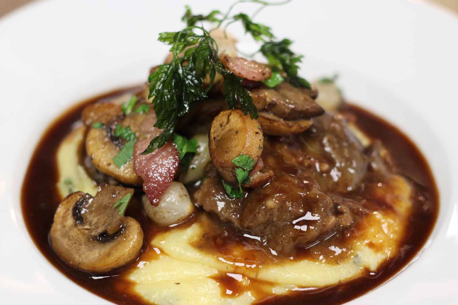 Delicious braised pork cheeks bourguignon