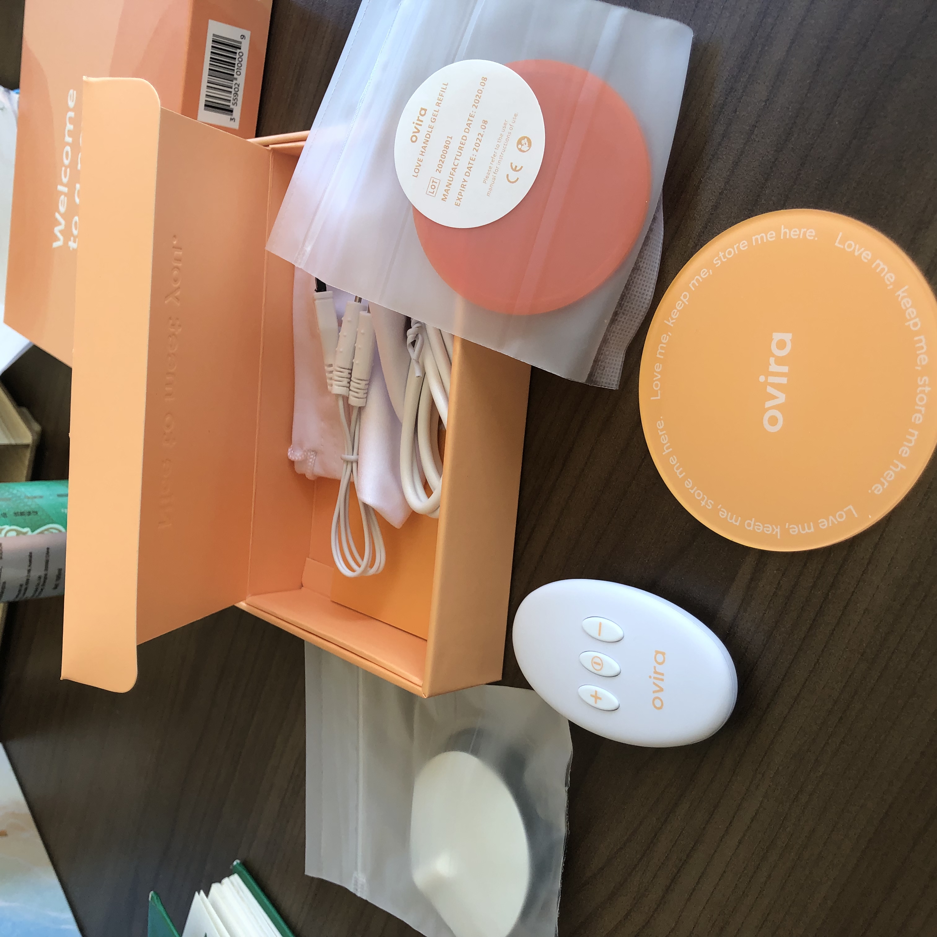 An unboxing image of Ovira TENS machine | DEANLONG.io