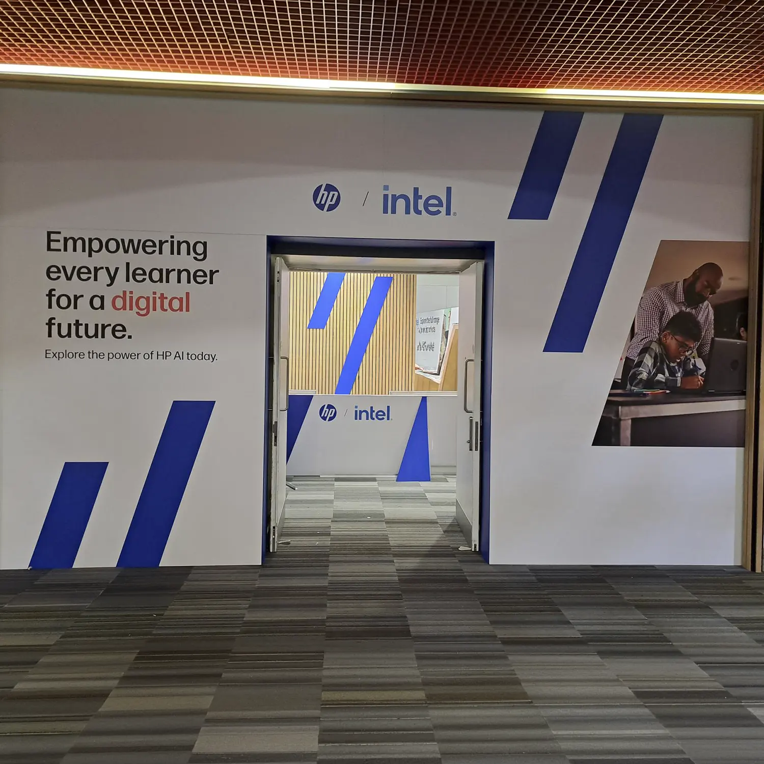 Branded HP exhibition archway installed above reception area at BETT 2026 exhibition