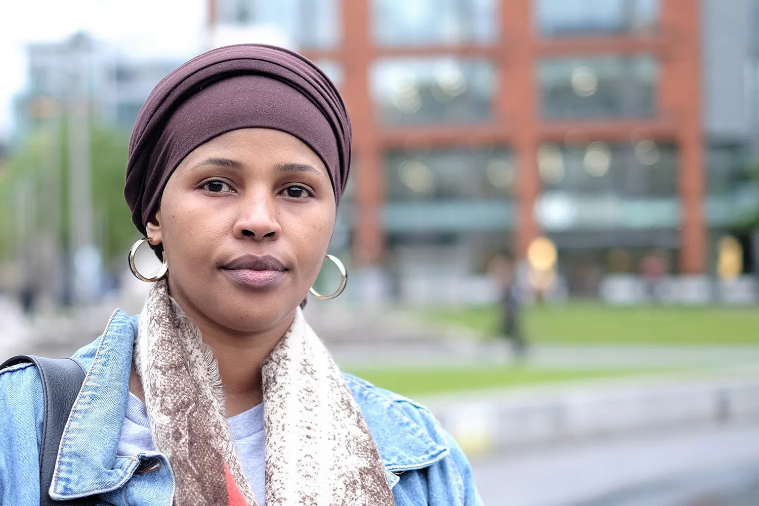Woman wearing a headscarf looking at the camera