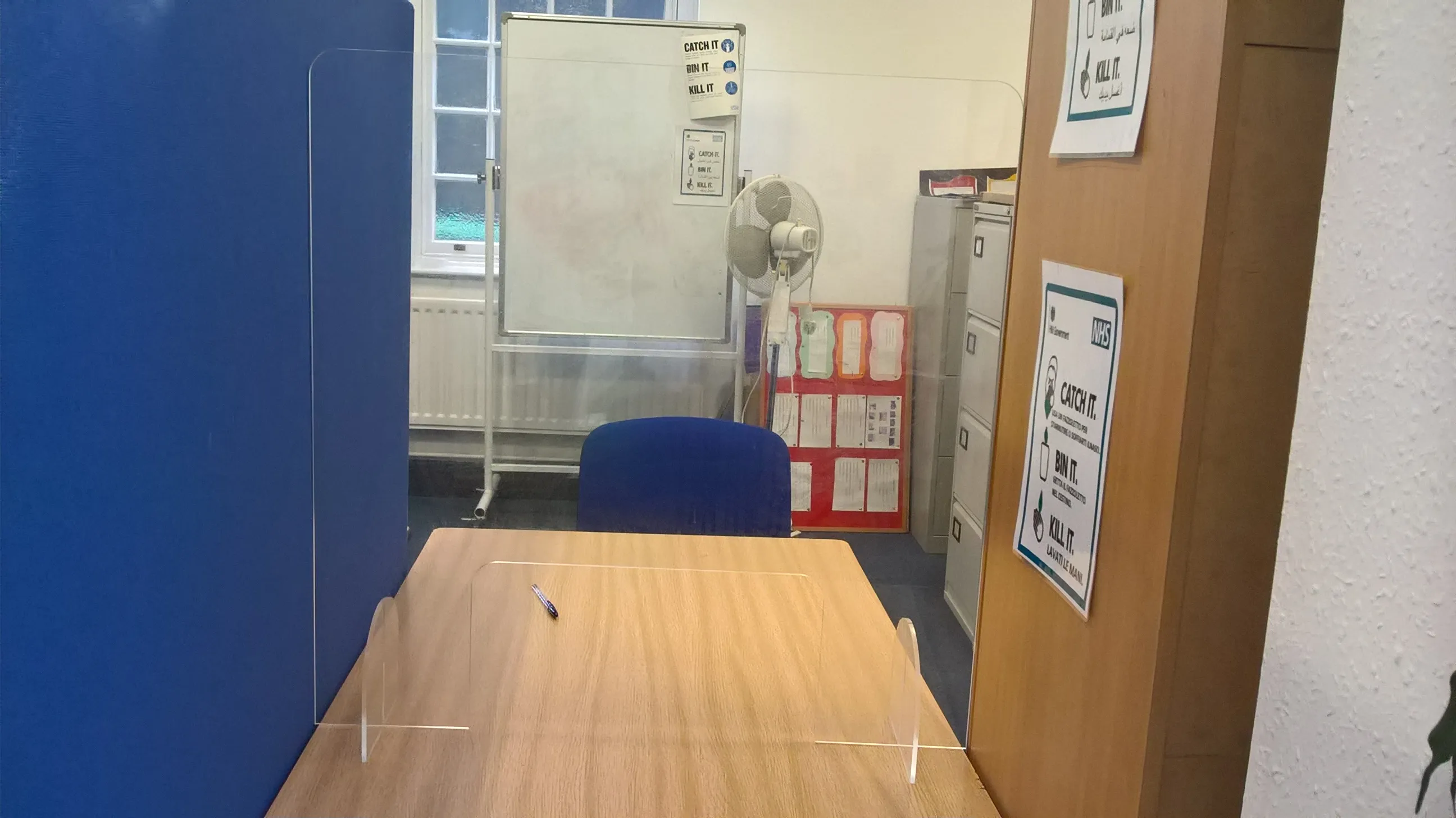 An image of desks at brushstrokes charity centre with PPE