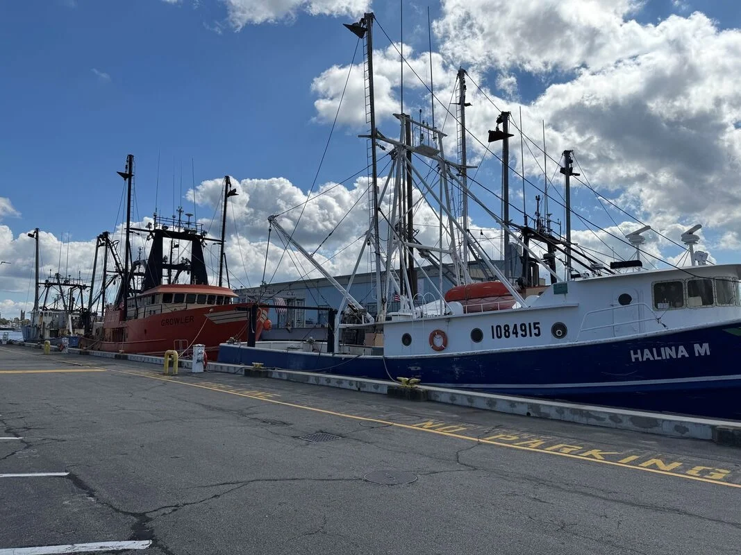 Commercial fishing boats docked along the New Bedford waterfront in New Bedford, MA