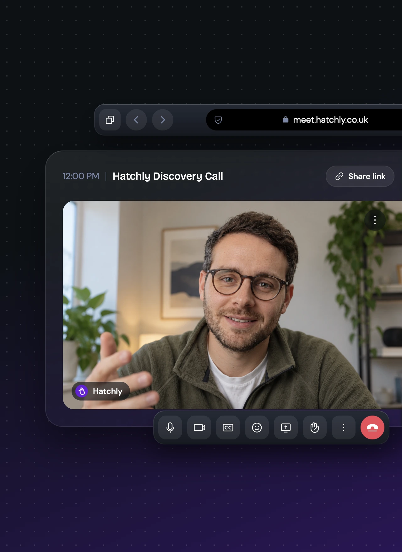 Screenshot of a video call interface labeled 'Hatchly Discovery Call' at 12:00 PM with a man wearing glasses, a green jacket, and white shirt speaking and gesturing with his hand, with plants and a framed picture in the background.