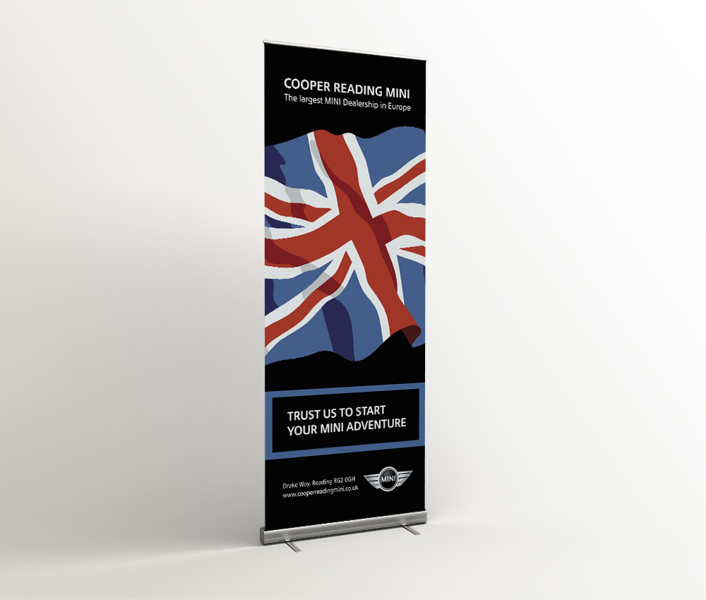 Cooper Reading MINI roll-up banner with a Union Jack and the line 'Trust us to start your new adventure'