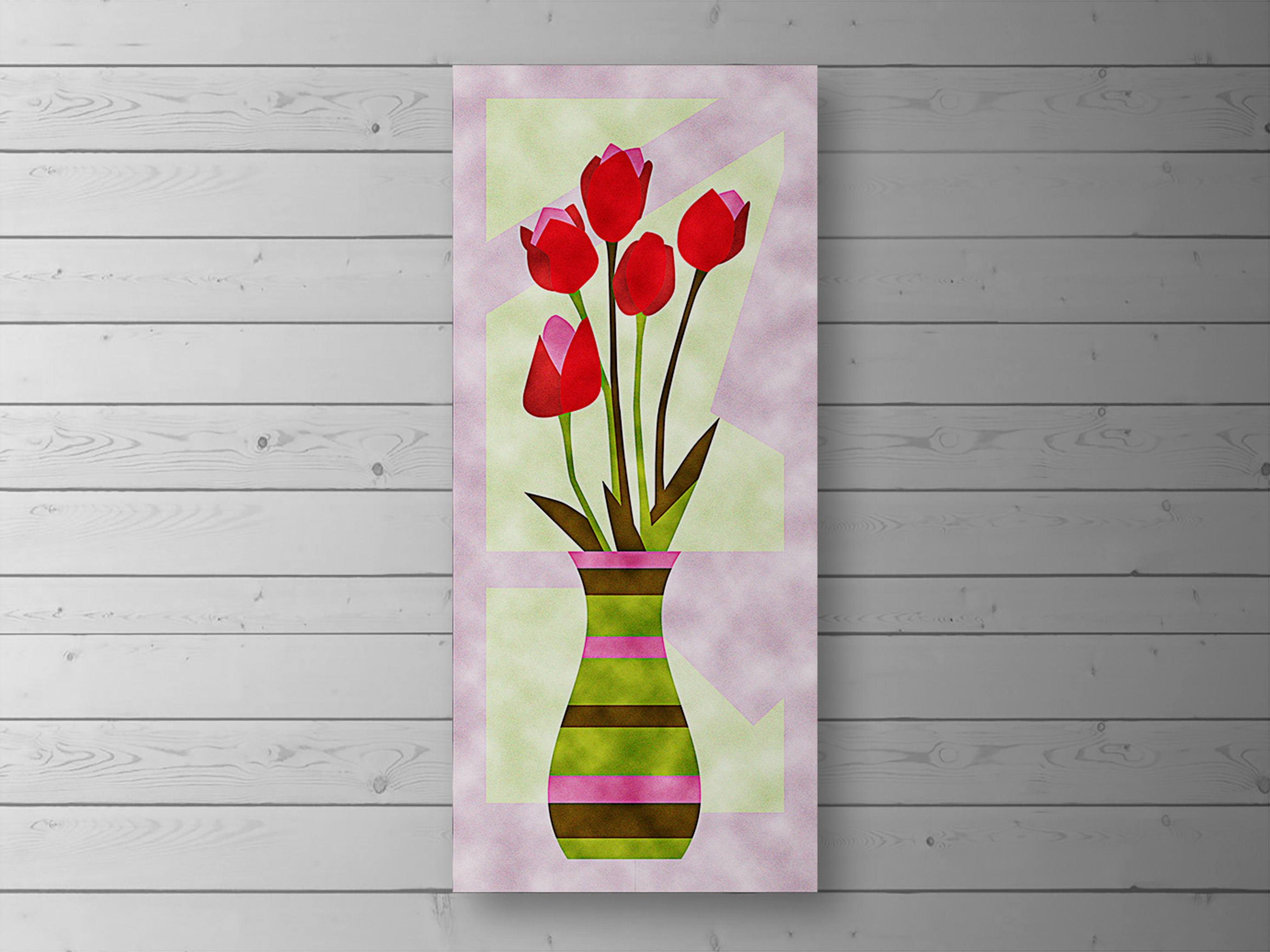 Tall velvet patchwork wall hanging of red tulips in a striped vase, on a white wooden wall
