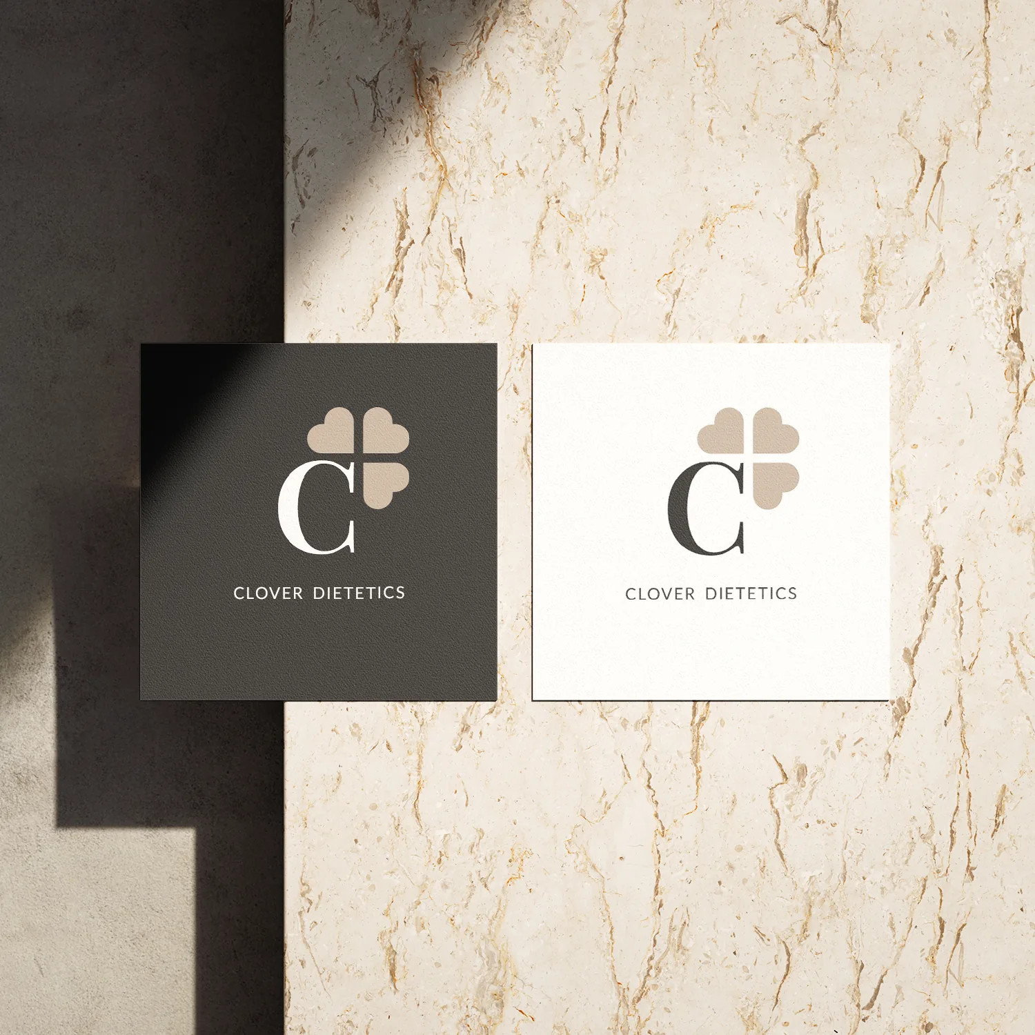 Clover Dietetics logo on light and dark square business cards