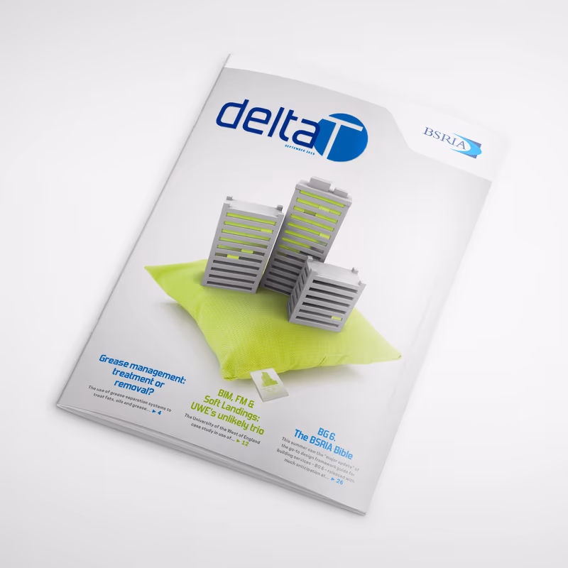 Cover of Delta T magazine showing grey tower blocks on a lime-green cushion.