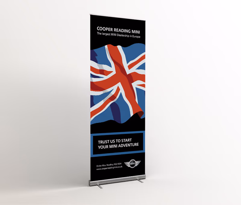 Cooper Reading MINI roll-up banner with a Union Jack and the line 'Trust us to start your new adventure'