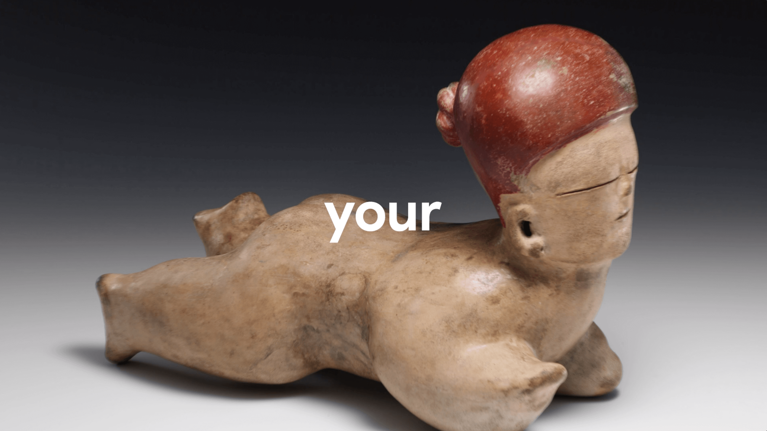 Pre-Columbian-style ceramic figurine of a reclining person with a red headdress against a gradient dark background.