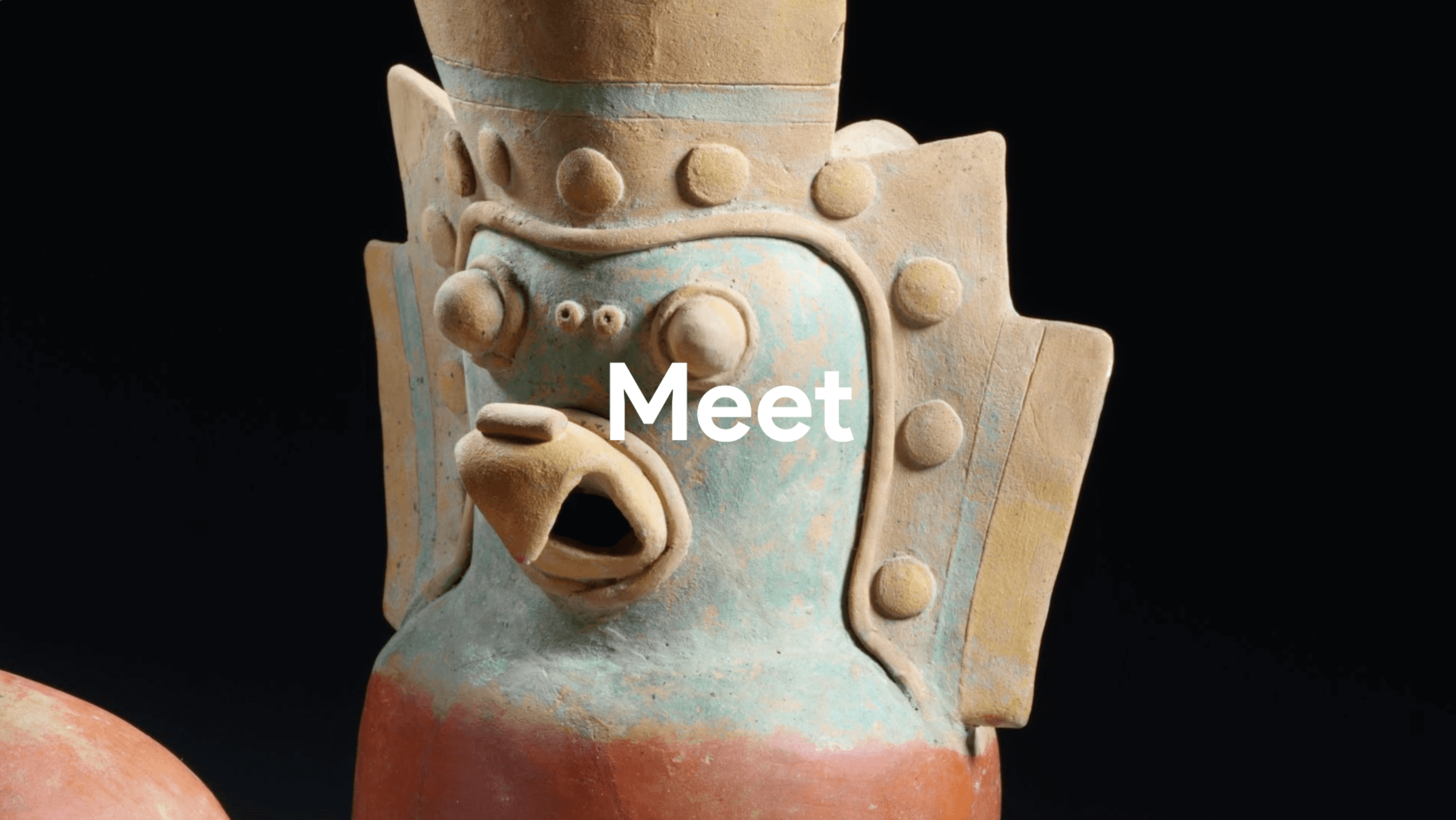 Close-up of an ancient ceramic bird-shaped vessel with turquoise, beige, and reddish paint on a black background.