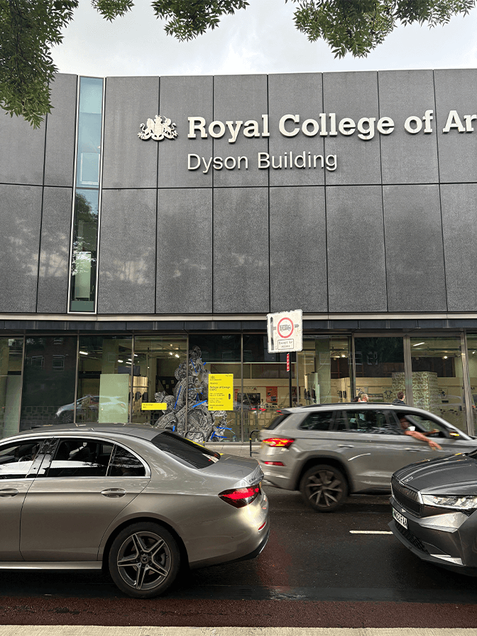 Black and white sketch of a dog's head in profile on a beige background with the words 'goodest boy.' in white text across the center.