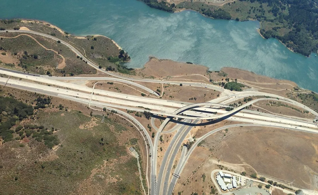 a drone view for highway Interchange by a river near Ralston Avenue Bike Trail, Belmont, CA 94002, USA, United States