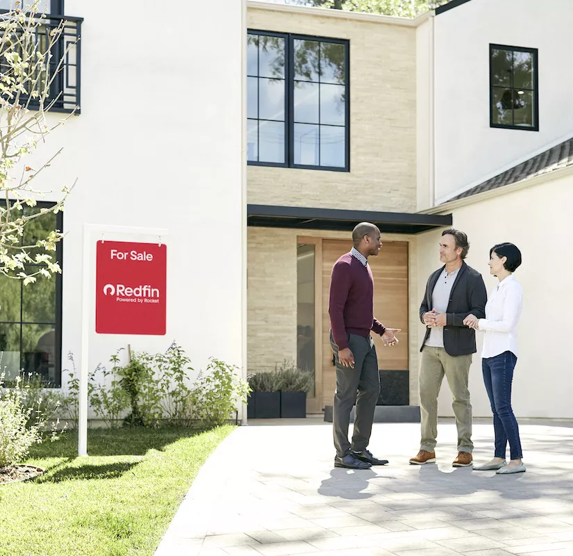Redfin agent speaking with homeowners for a white-glove moving guide featuring Bystroff Moving
