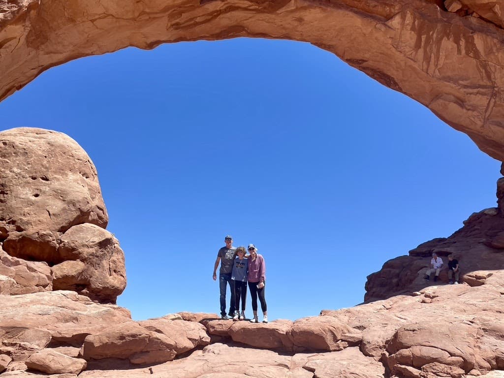 family hiking off grid