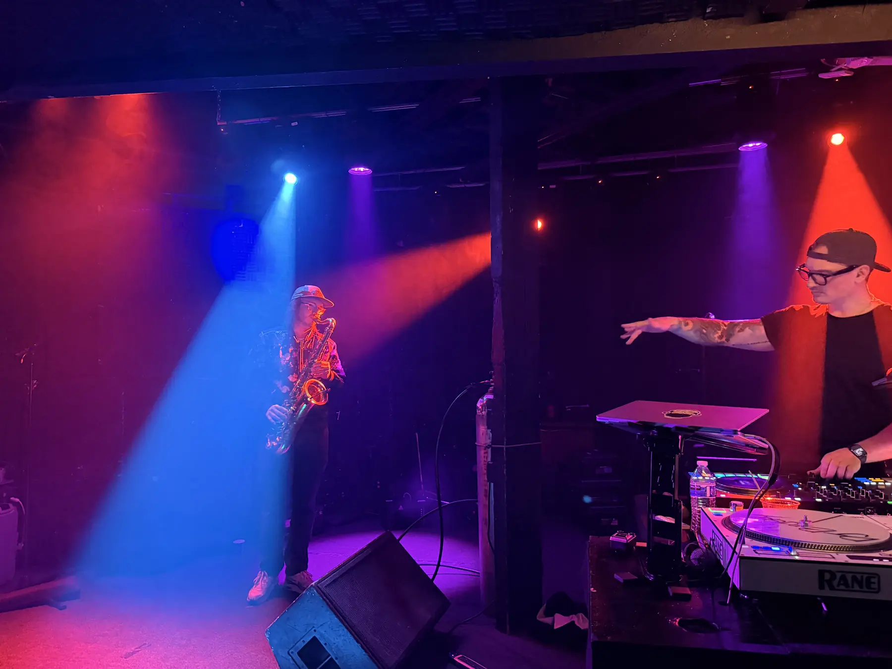 Aidan performs live saxophone on stage while Jordan Waldo DJs an RMF event