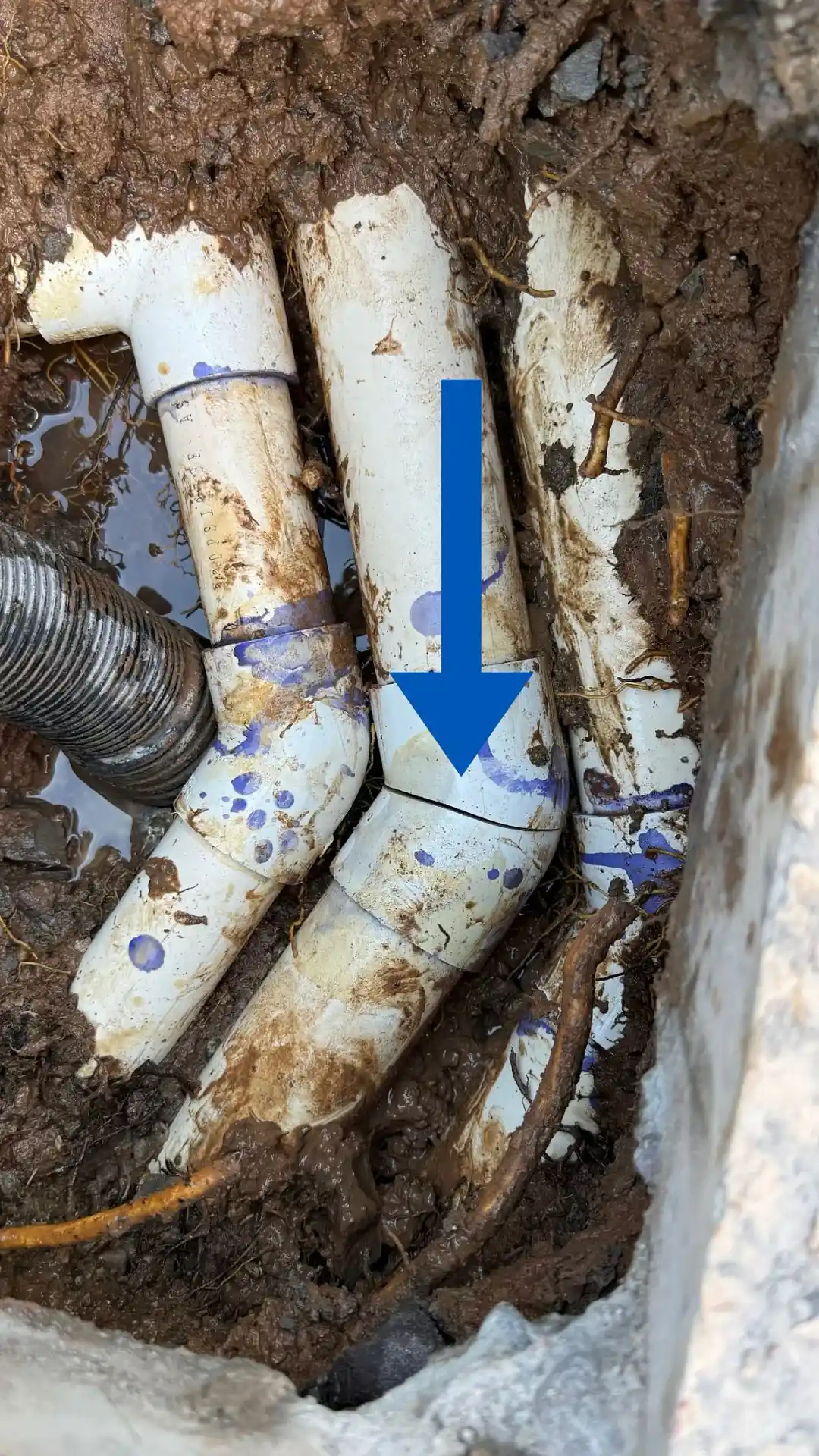 Broken 45 degree PVC fitting on underground pool return line beneath cool deck in Scottsdale, Arizona