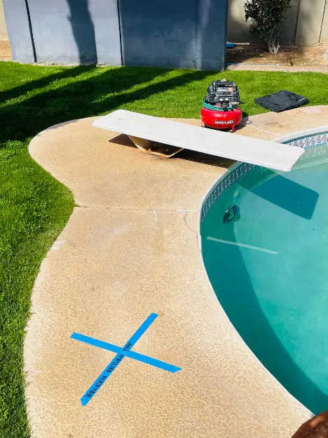 Pool plumbing leak location marked on pool deck by Leak Tech LLC in Scottsdale AZ