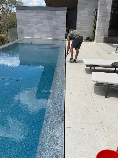 Leak Tech LLC technician testing a negative edge pool for leaks in Scottsdale AZ