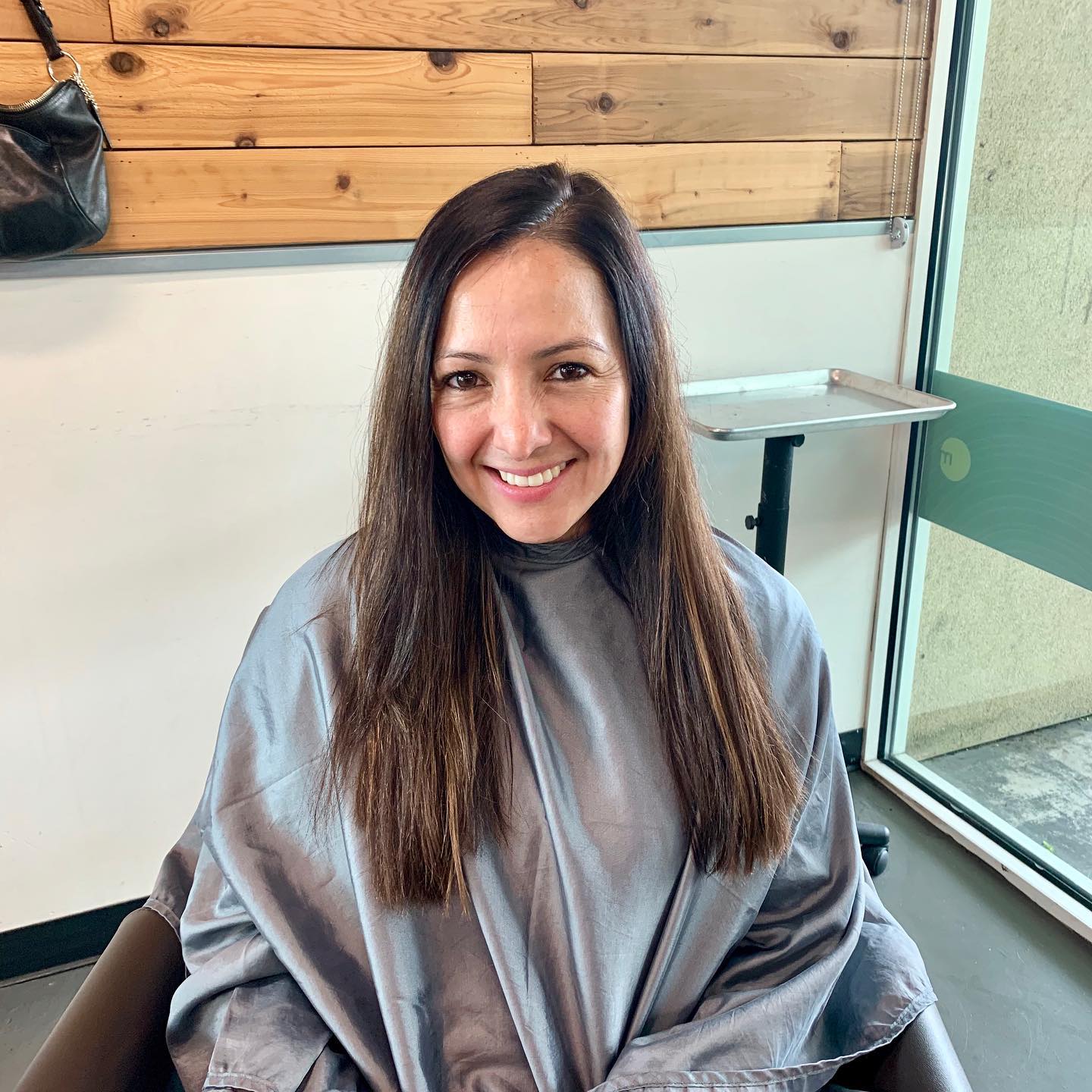 smiling woman at studio tru hair salon