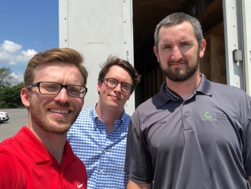 Evan Jarecki from Gimme Vending in the field on a route with a route driver, Dale, from Lincoln County Vending.