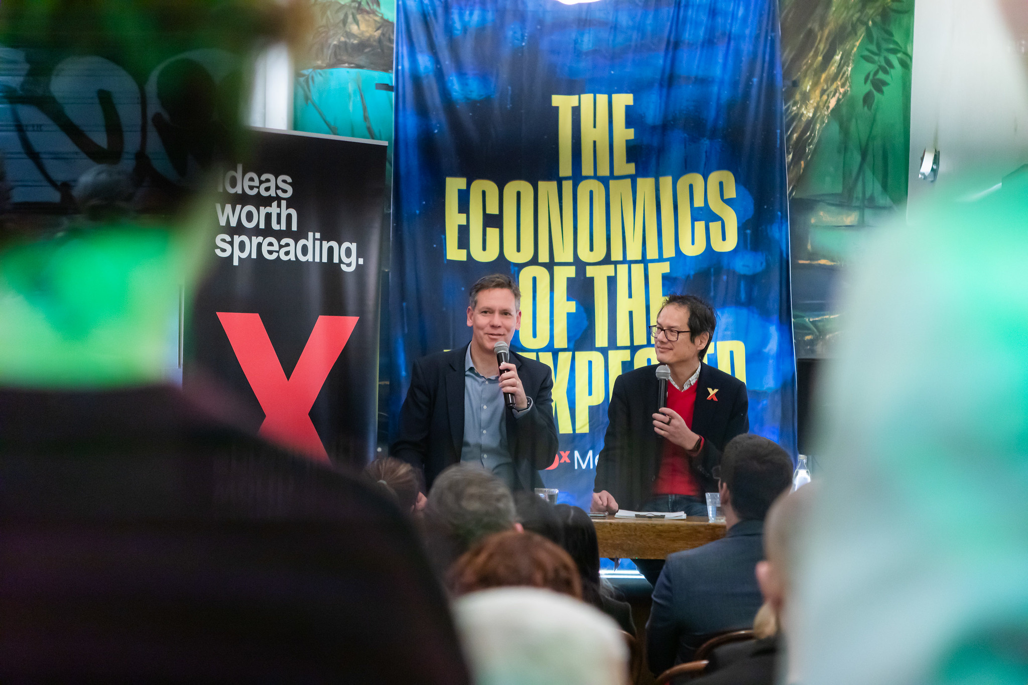 Two speakers sitting talking at a TEDxMelbourne Event.