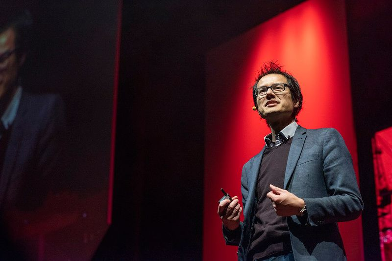 An image of Jon Yeo on the TEDxMelbourne stage.