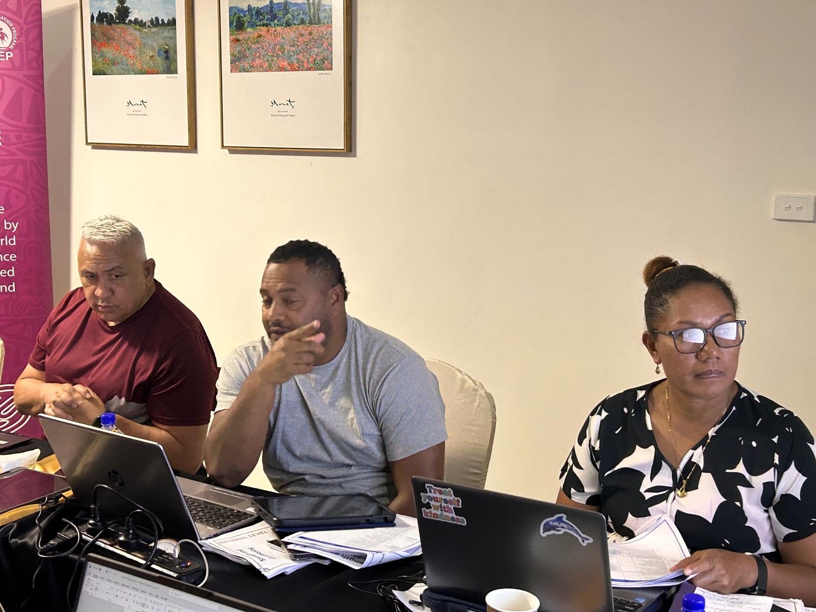Workshop participants reviewing course material in Nadi