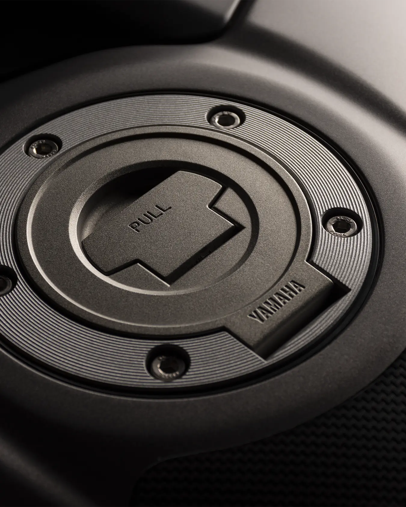 Studio lighting product shot of a Yamaha gas cap.