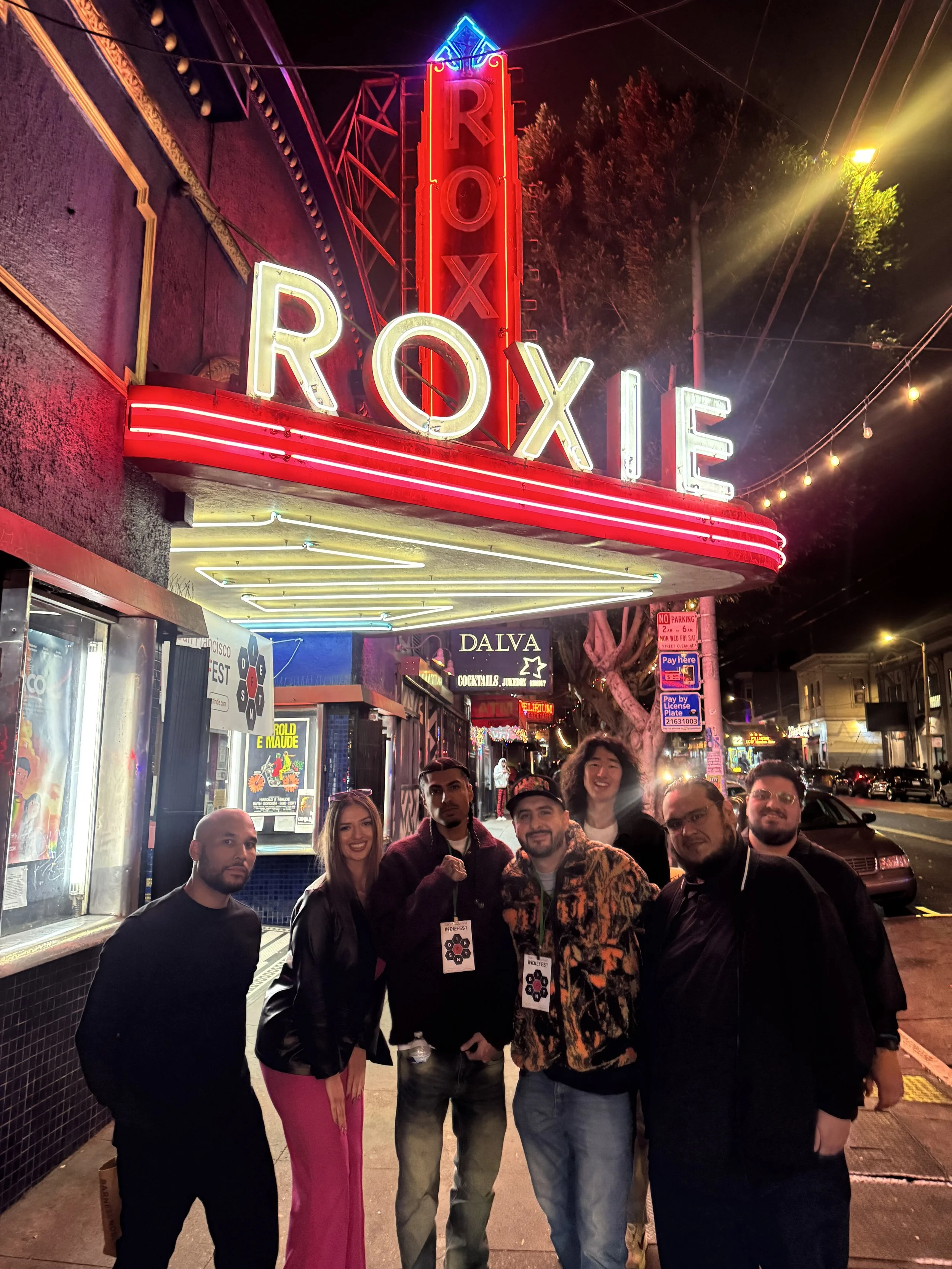 Guests gather beneath the illuminated Roxie marquee.