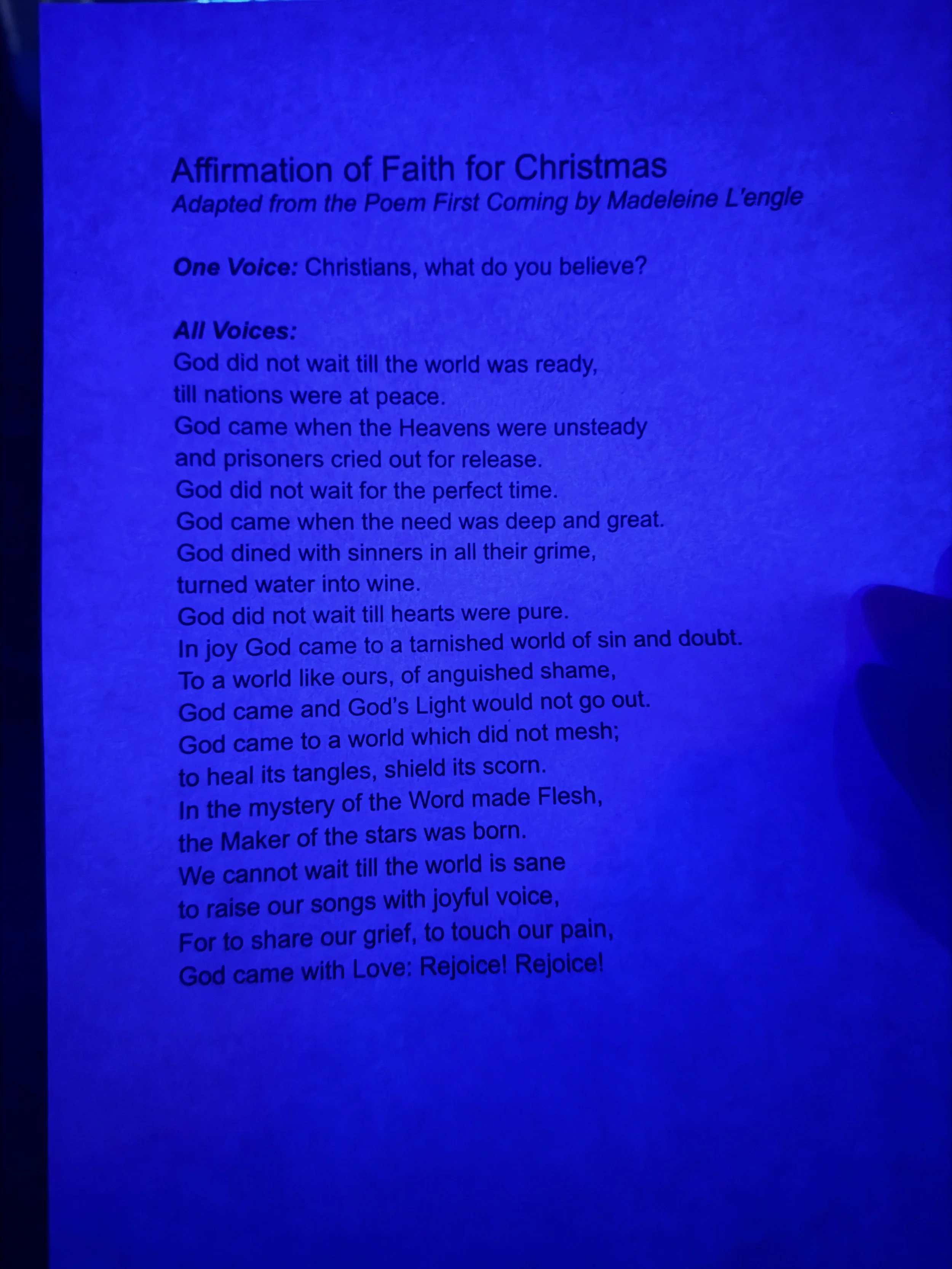 An Affirmation of Faith reading displayed under blue light.