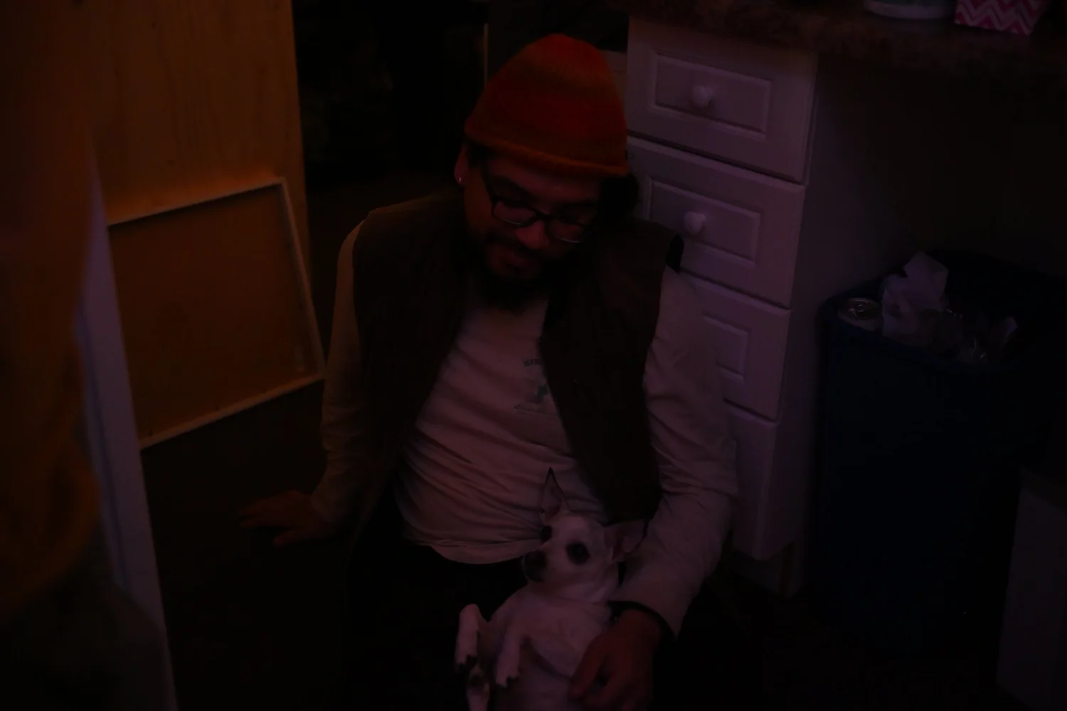 A participant holds a small dog during the gathering.