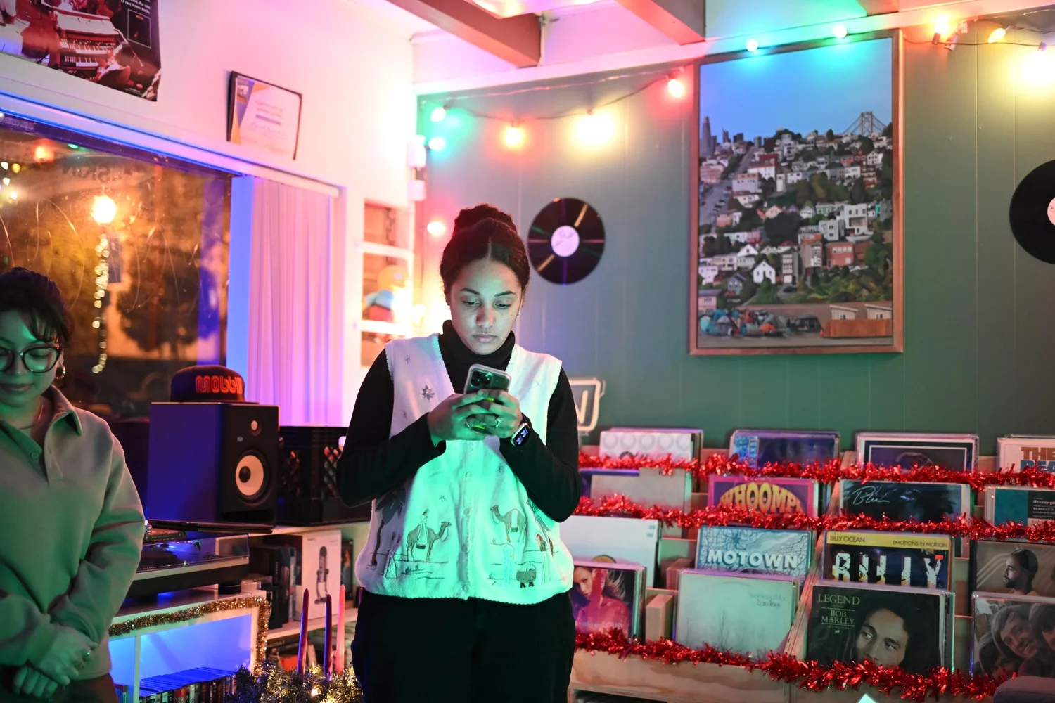A participant reads aloud inside the record shop.