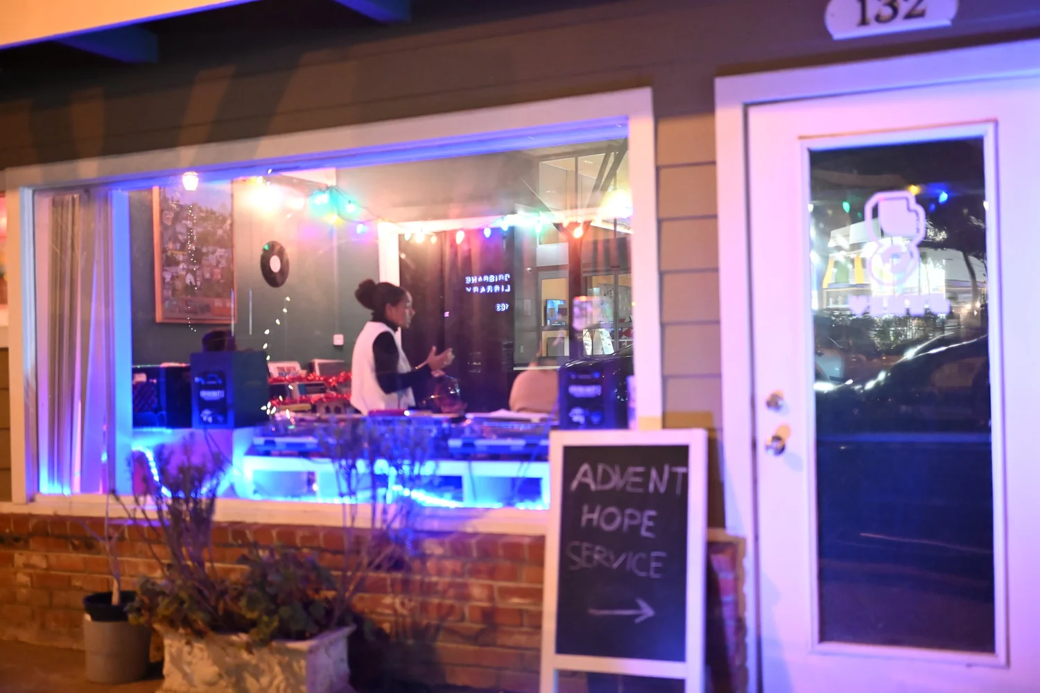 The LYRICAL storefront decorated with colorful lights.