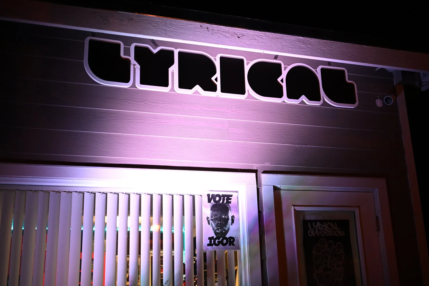 Illuminated Lyrical sign above the venue entrance.