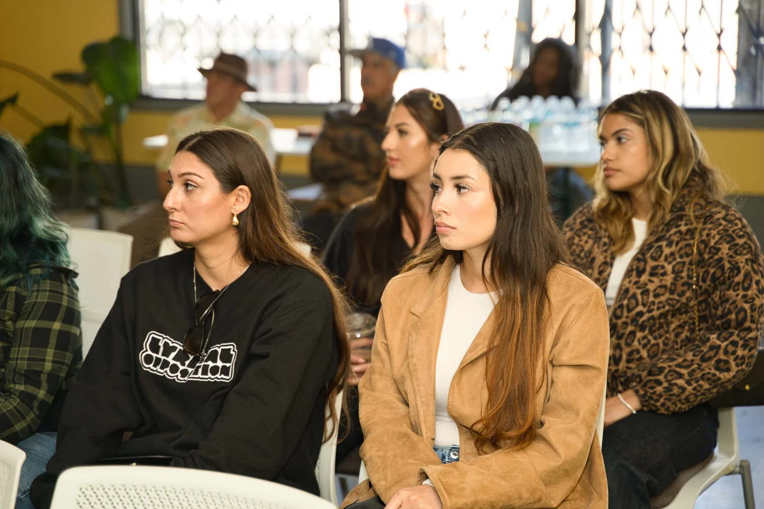 Attendees seated facing the front of the room.
