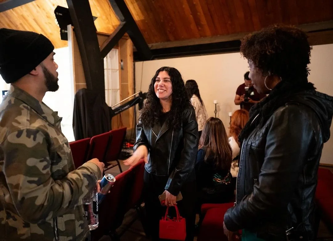 Guests talk together before the screening.
