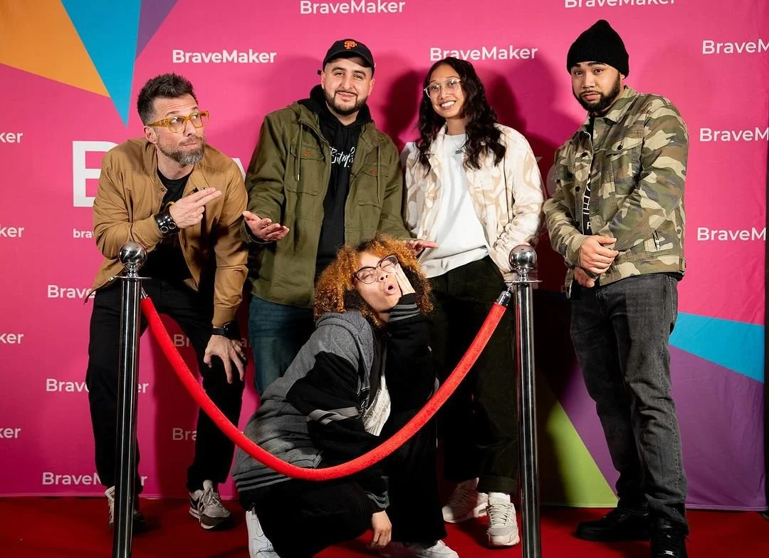 Filmmakers and guests gather behind a red velvet rope.