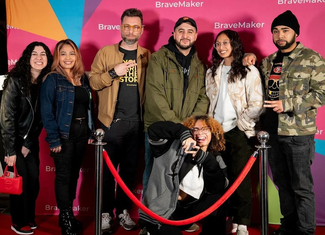 Group portrait against the BraveMaker backdrop.