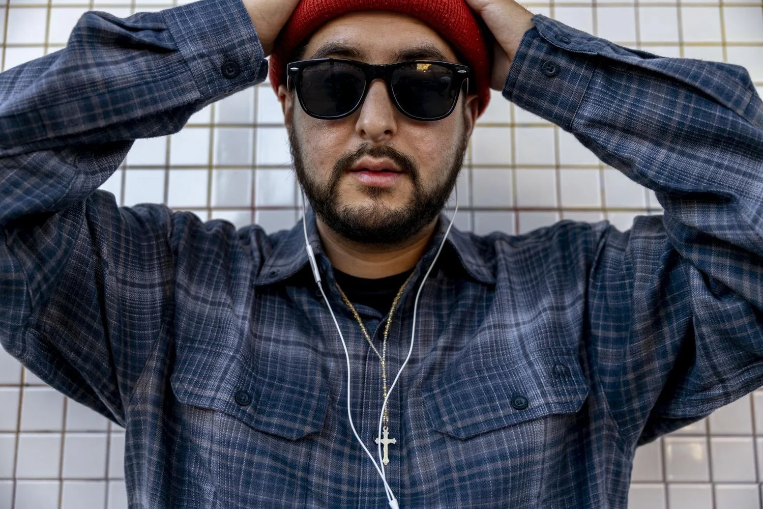 Fego wears a crucifix that was gifted to him by a friend when they visited El Salvador. ( Emily Curiel / Xpress Magazine)