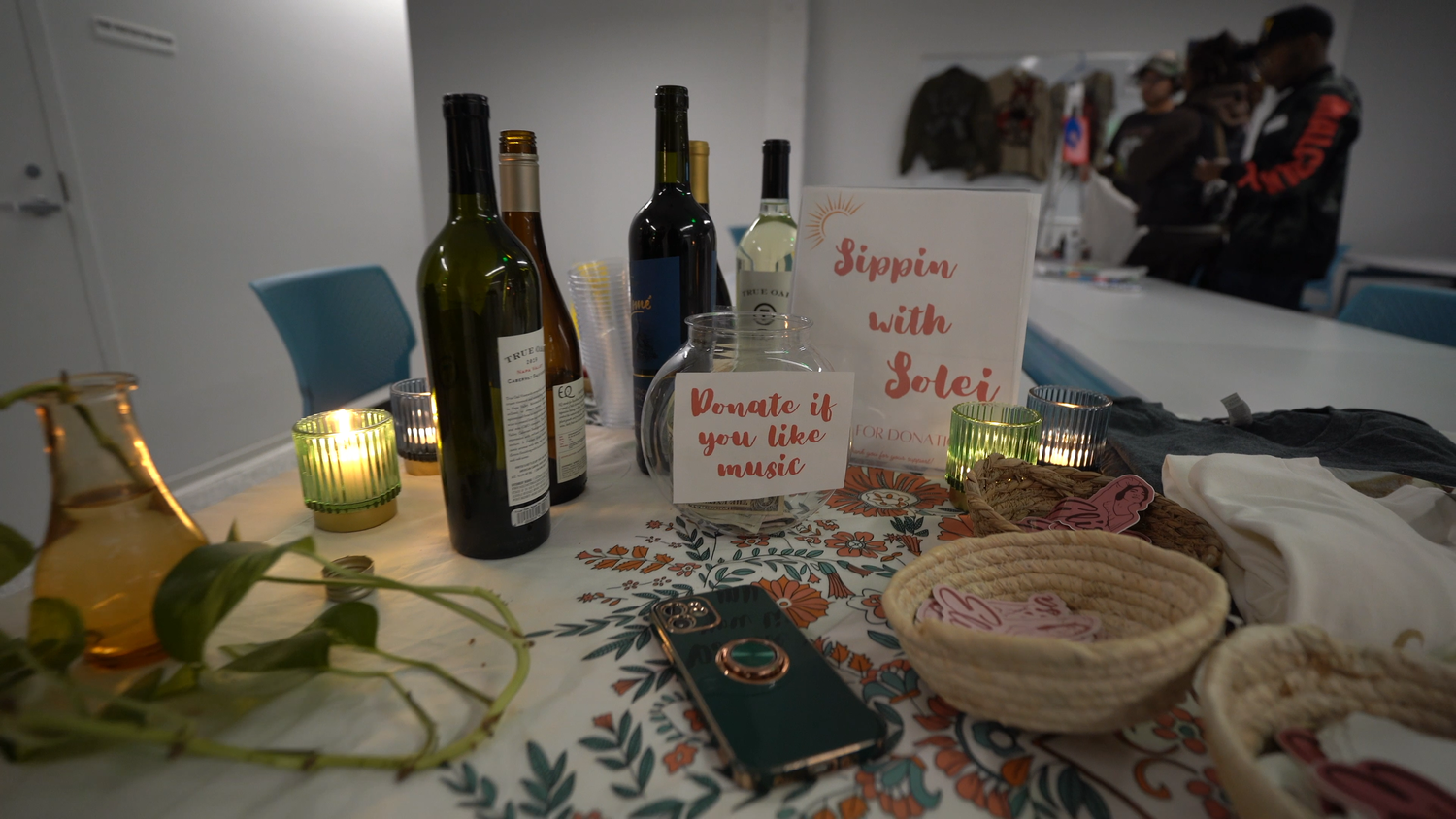 Refreshments and an event sign arranged on a table.