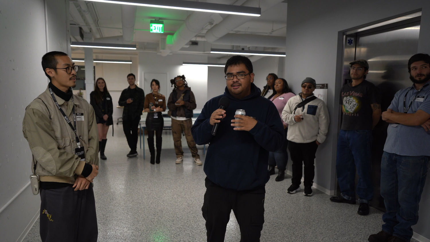 Guests listen to a speaker inside the gallery.